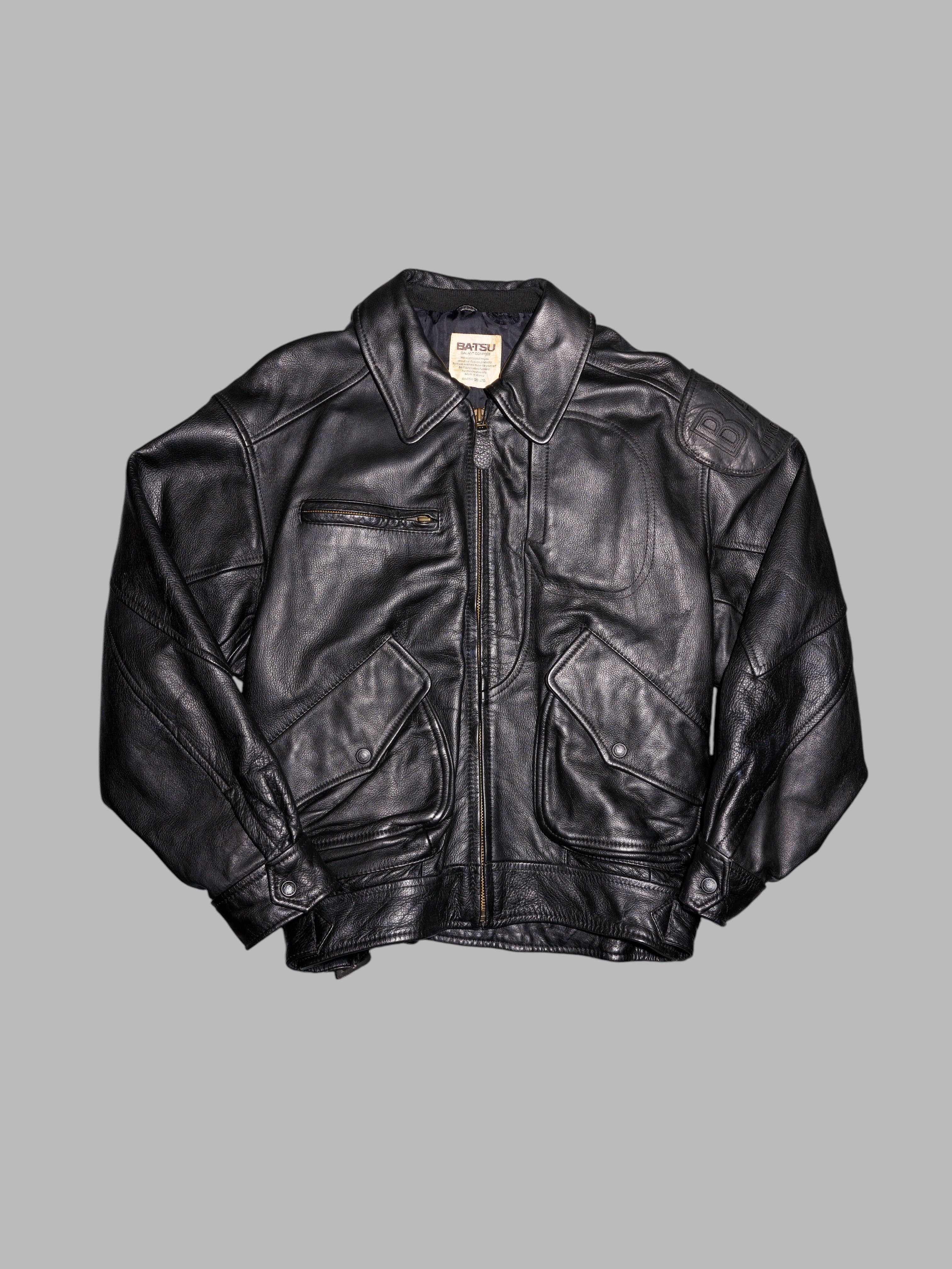 Ba-tsu 1980s thick black leather bomber jacket with shoulder patch