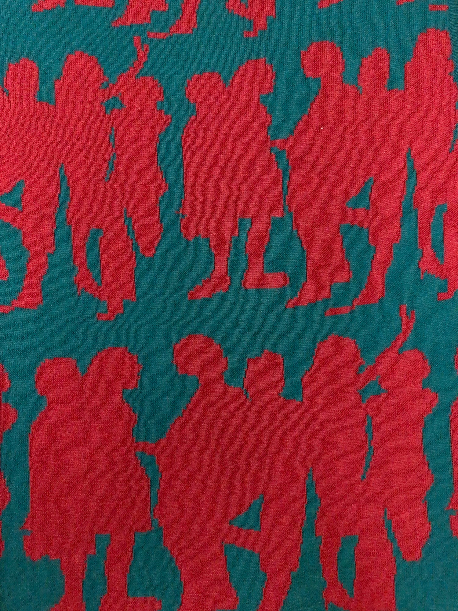 Jocomomola de Sybilla green knitted cotton vest with red dancing figures