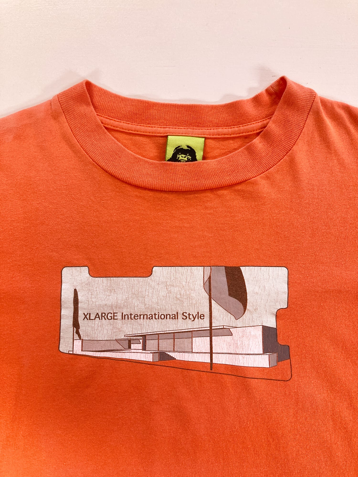 X-LARGE 1990s fluorescent orange ‘International Style’ graphic logo t-shirt