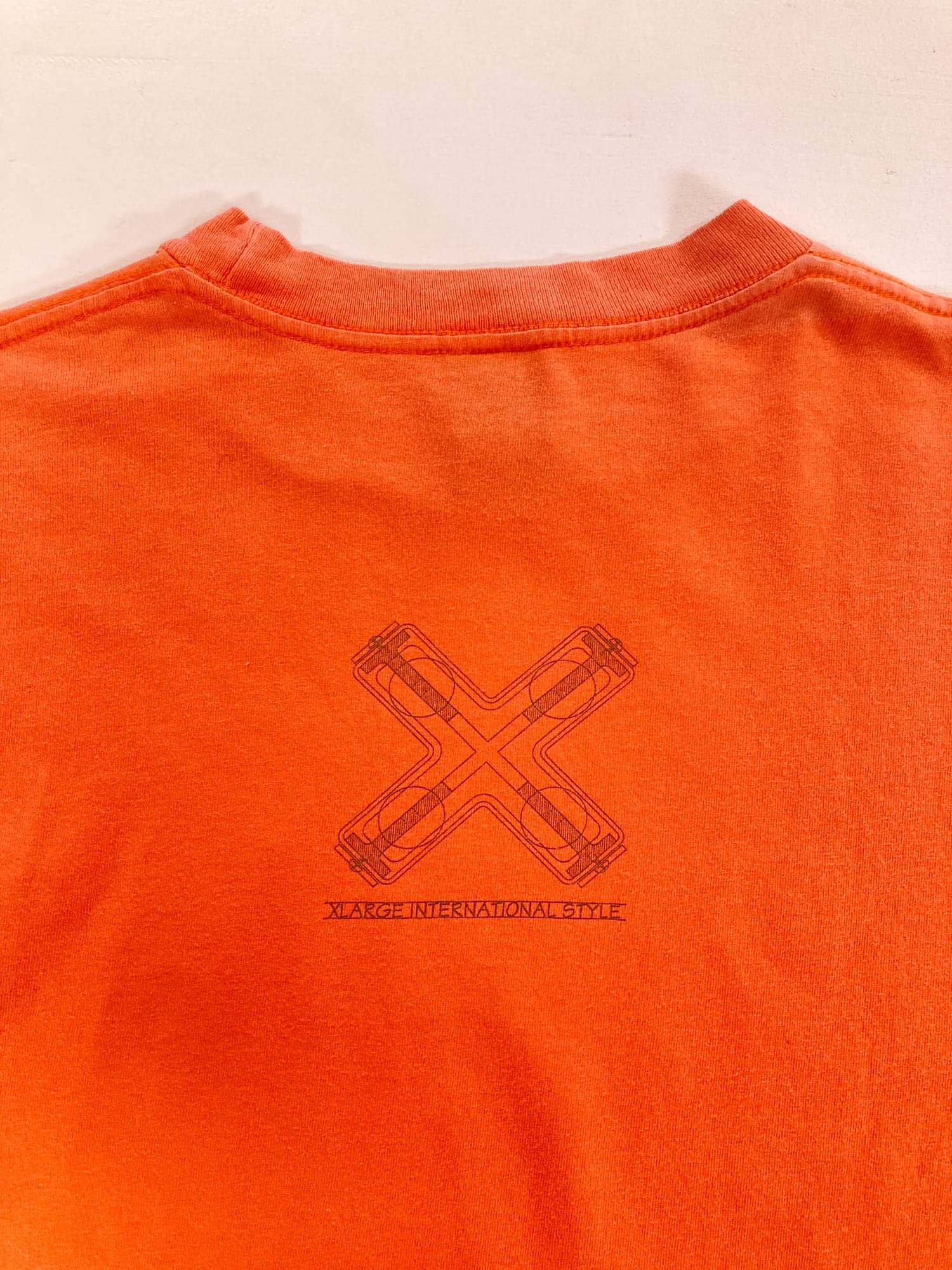 X-LARGE 1990s fluorescent orange ‘International Style’ graphic logo t-shirt