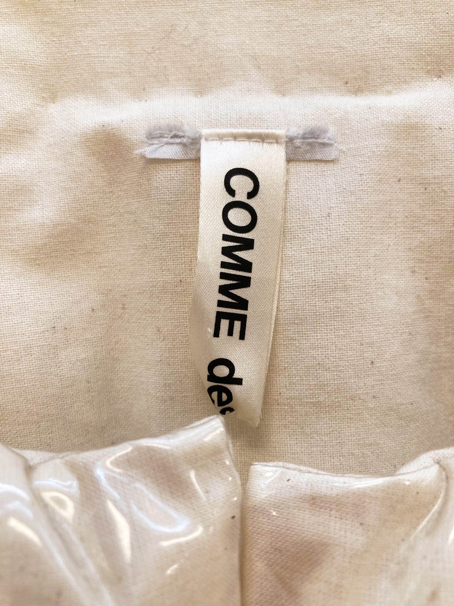 Comme des Garcons spring 2018 vinyl covered puffy calico vest