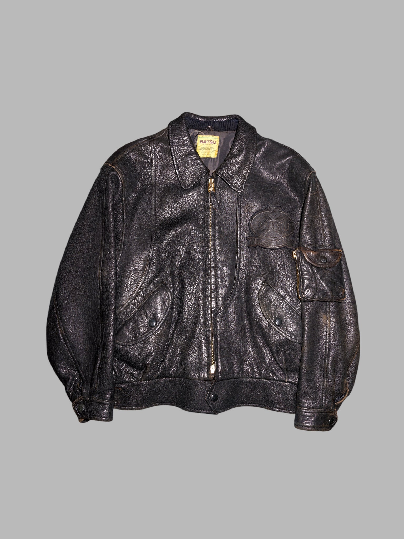 Ba-tsu 1980s distressed black or dark brown leather zip jacket