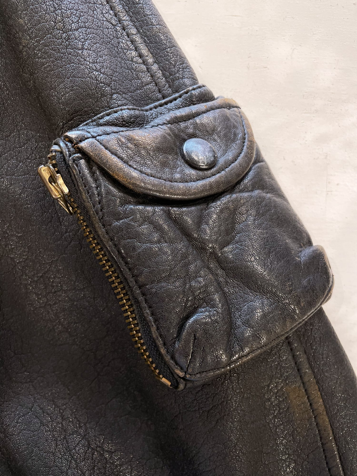 Ba-tsu 1980s distressed black or dark brown leather zip jacket