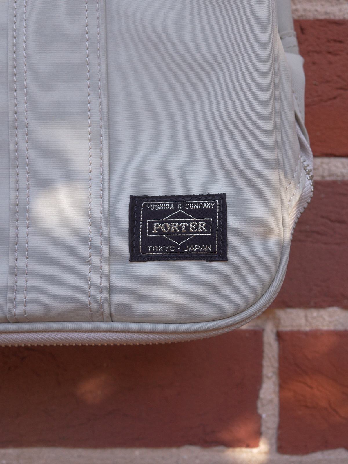 Porter light grey canvas zipped gusset hand bag