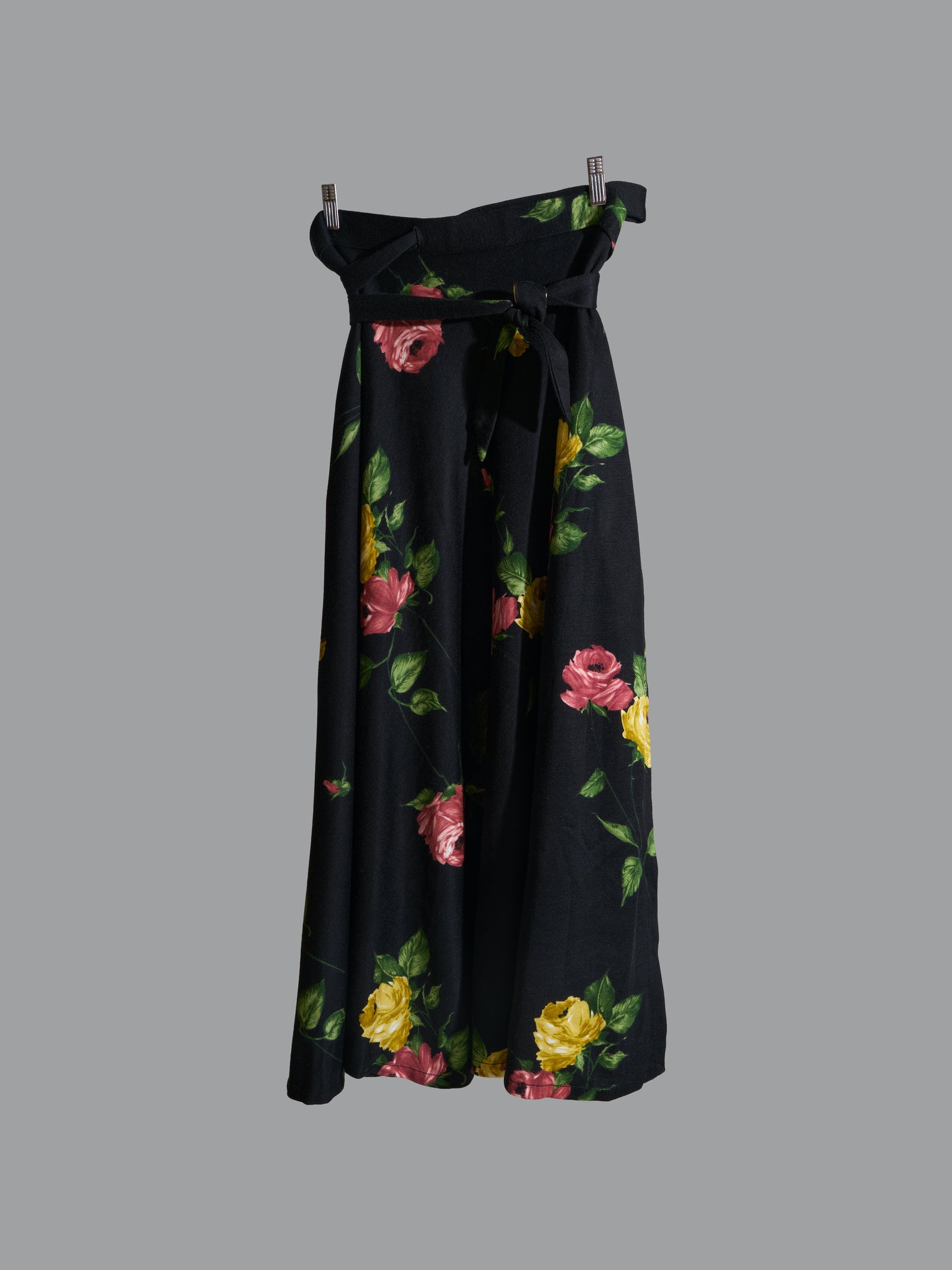 vintage 1970s black polyester wrap skirt with red and yellow floral rose print