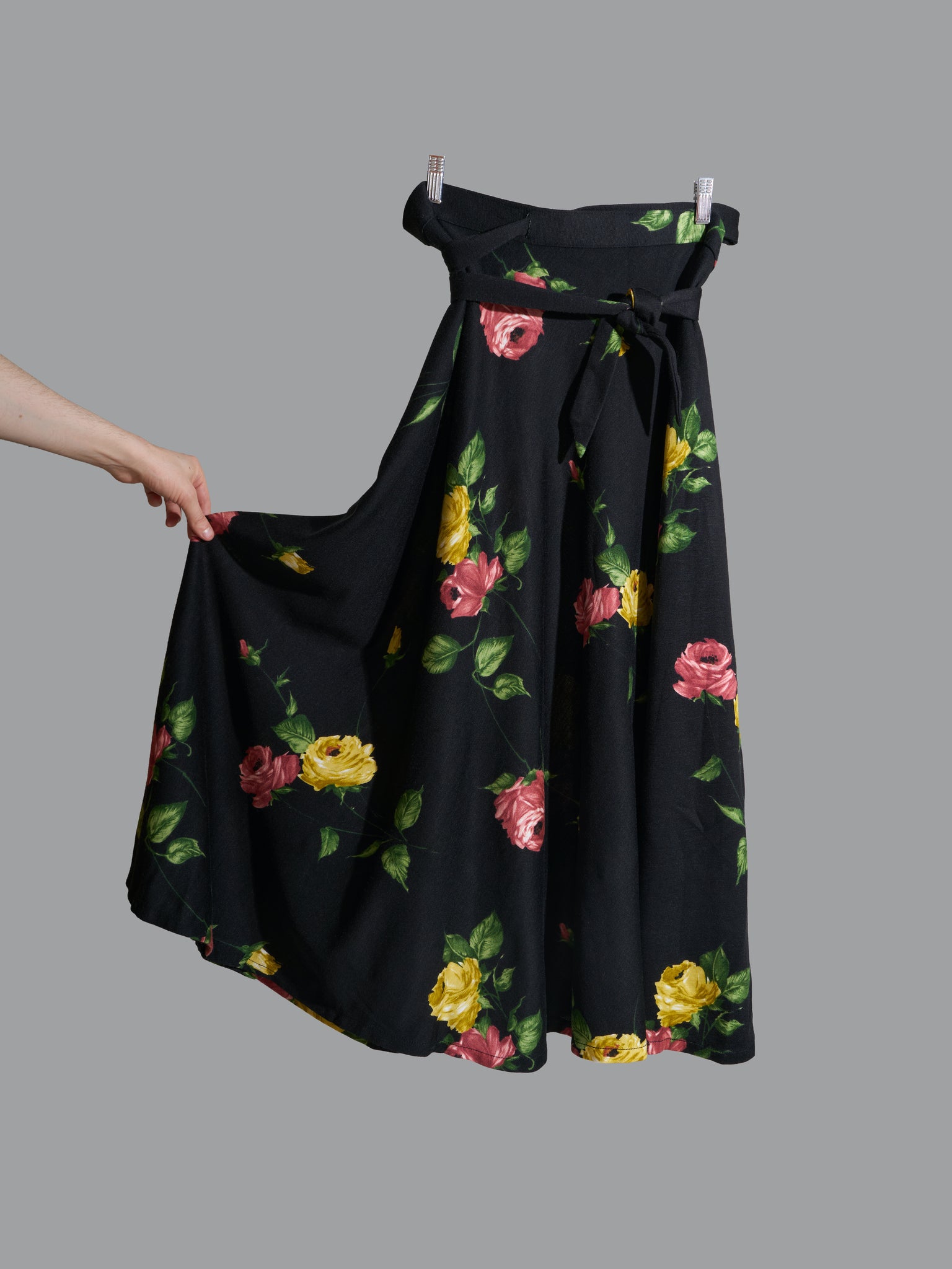 vintage 1970s black polyester wrap skirt with red and yellow floral rose print