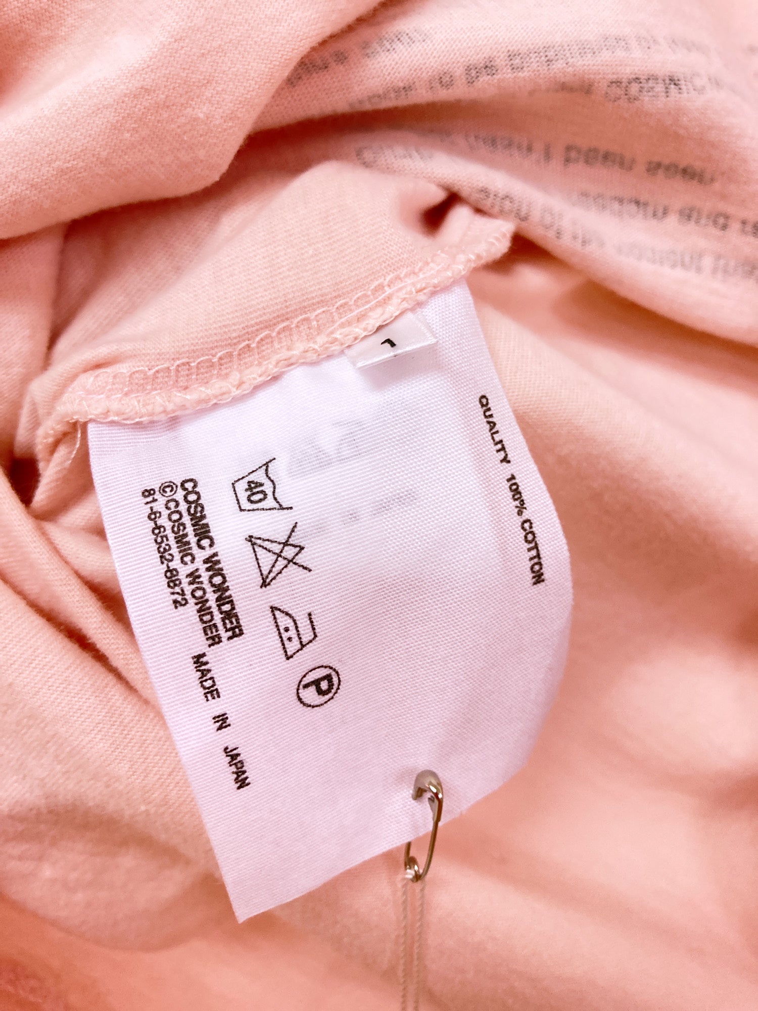 Cosmic Wonder pink t-shirt with print of 'Cosmic Wonder Free Press