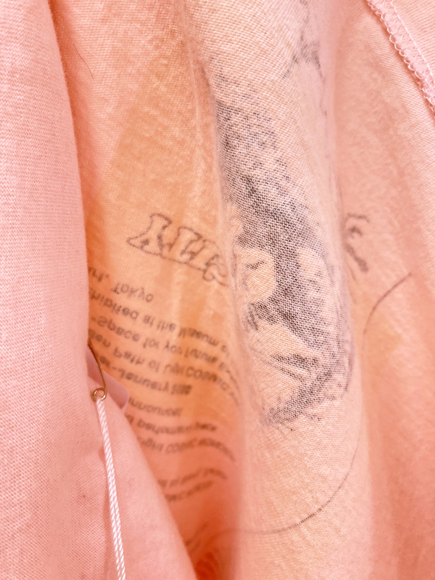 Cosmic Wonder pink t-shirt with print of 'Cosmic Wonder Free Press