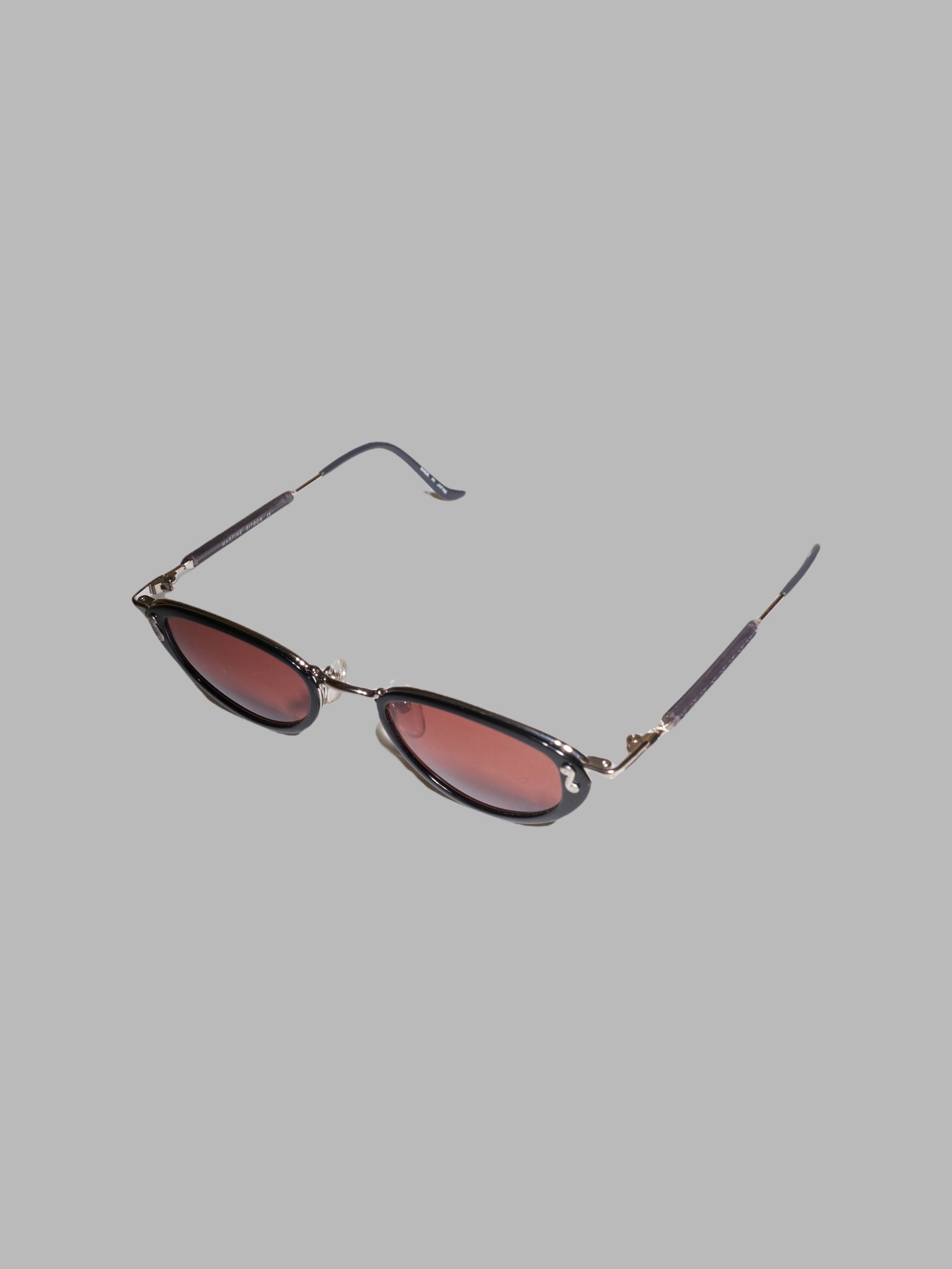 Martine Sitbon black framed sunglasses with dark red brown lenses