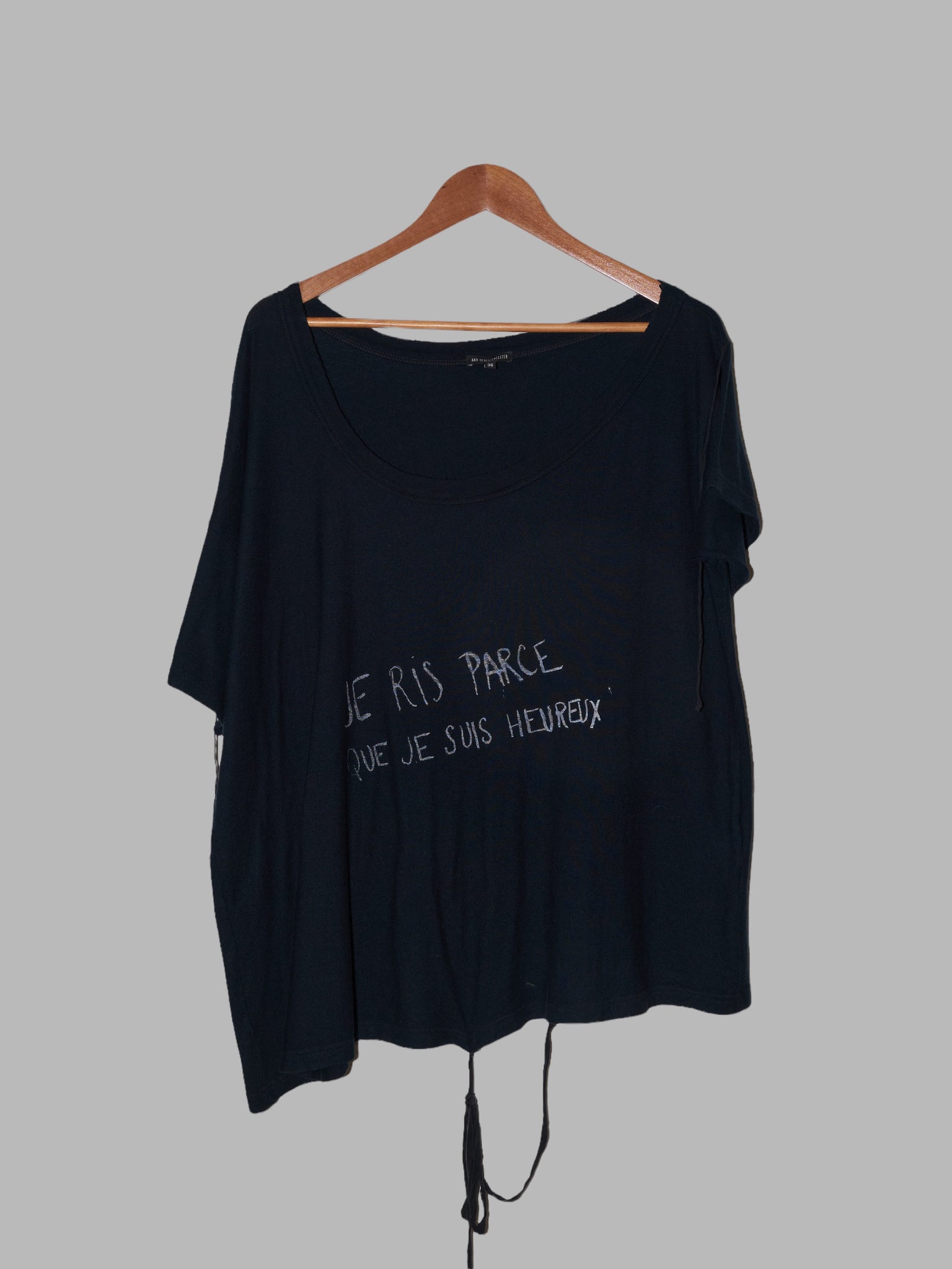 Ann Demeulemeester black low neck “I laugh because I’m happy” slogan t-shirt