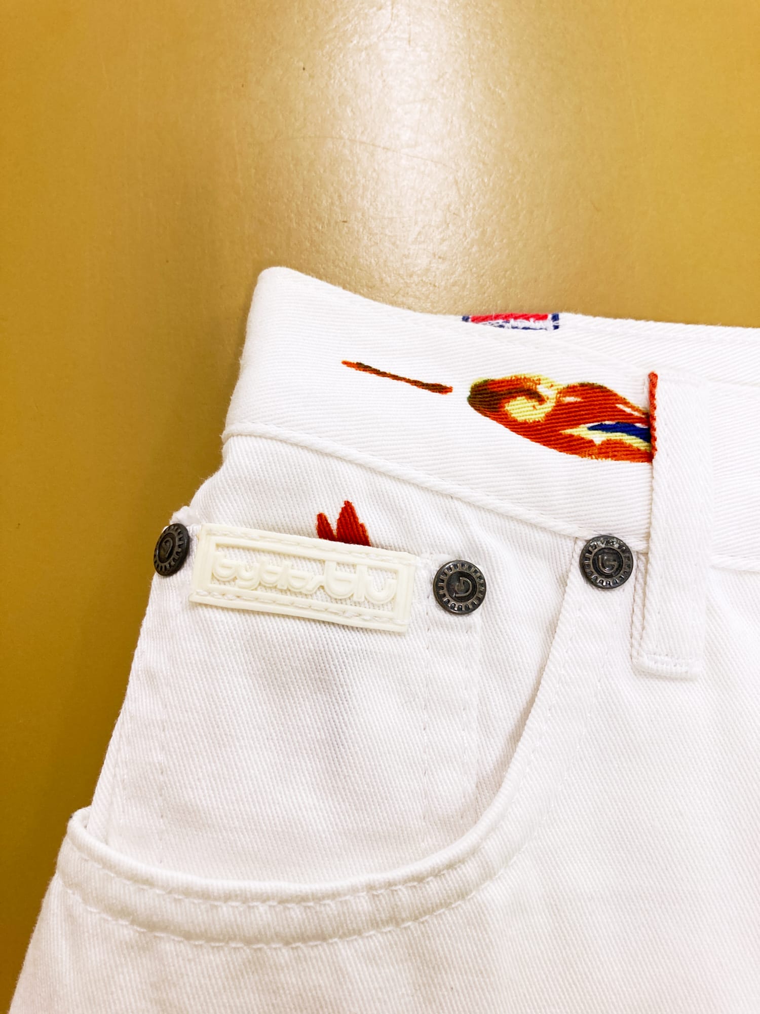 Byblos Blu 1990s white denim jeans with red floral and geometric print