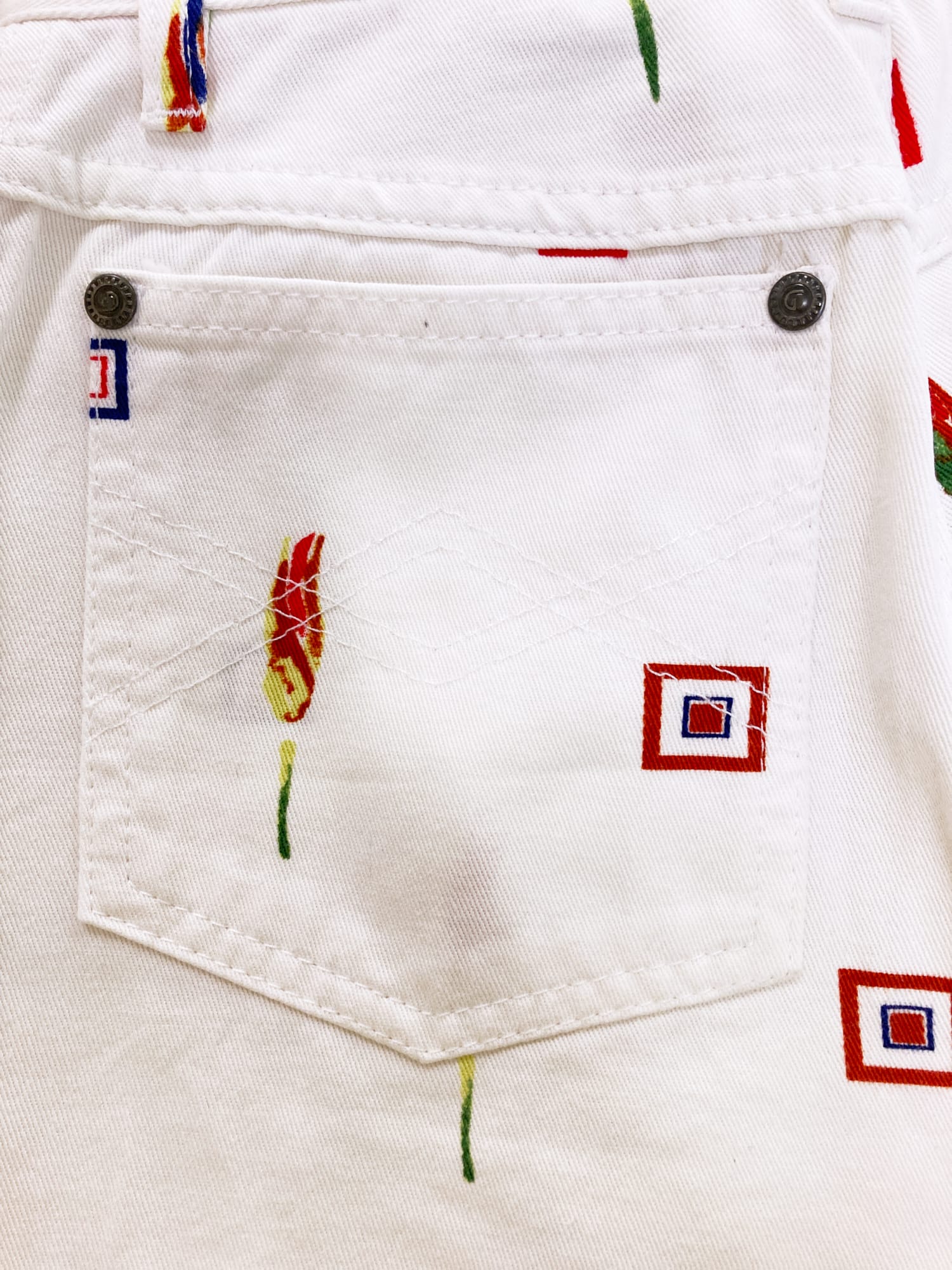 Byblos Blu 1990s white denim jeans with red floral and geometric print